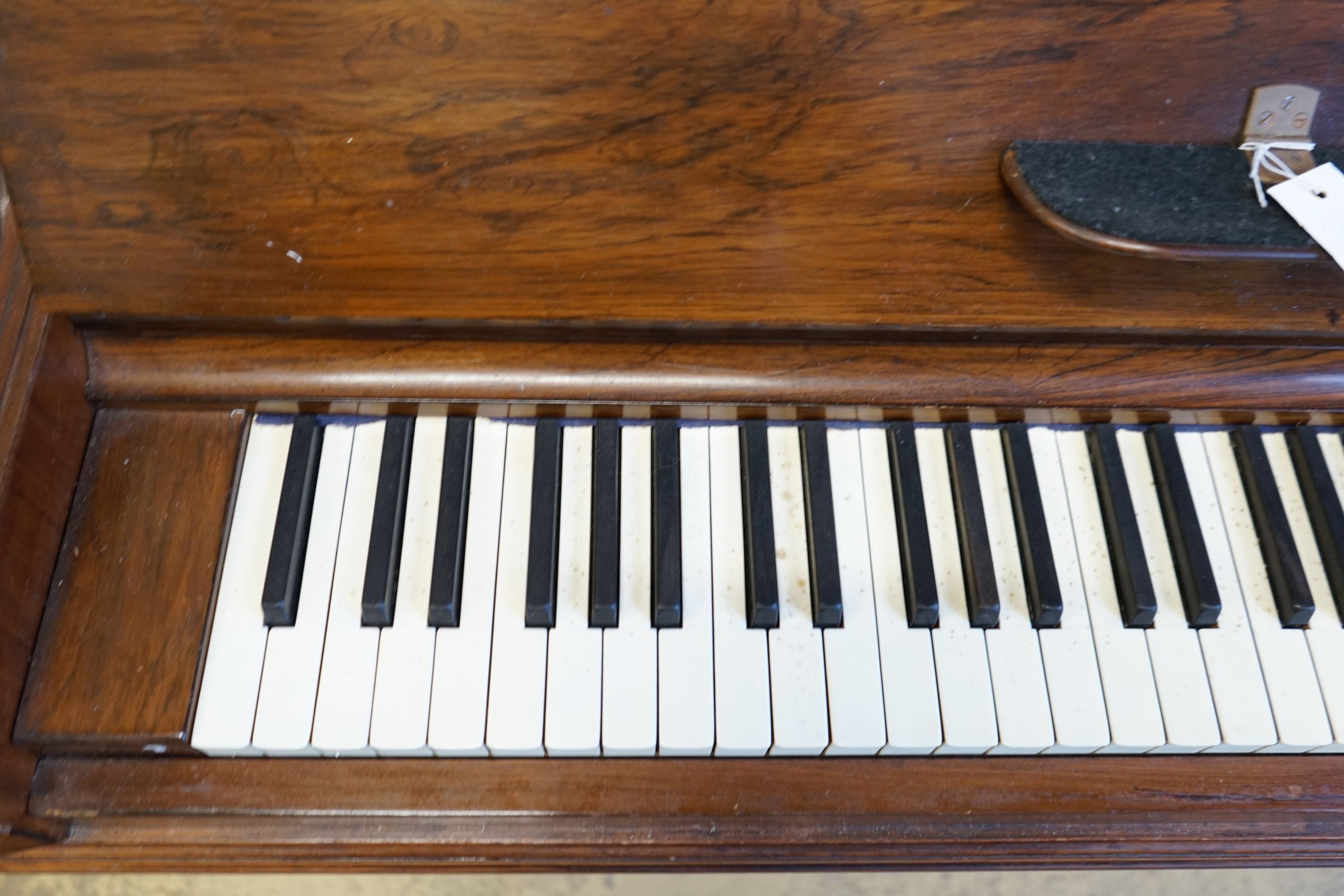 An early 20th century walnut cased Bluthner upright piano, Serial Number 92280